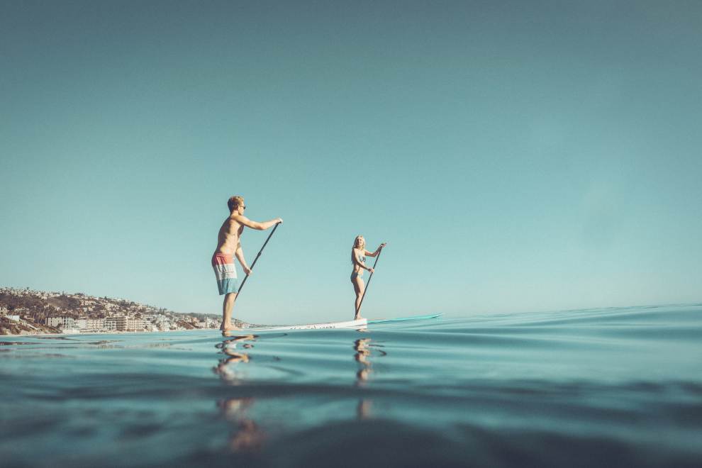 Two paddle boarders in Laguna Beach